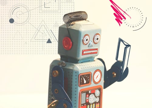 A toy robot reading a book – not how machine learning works